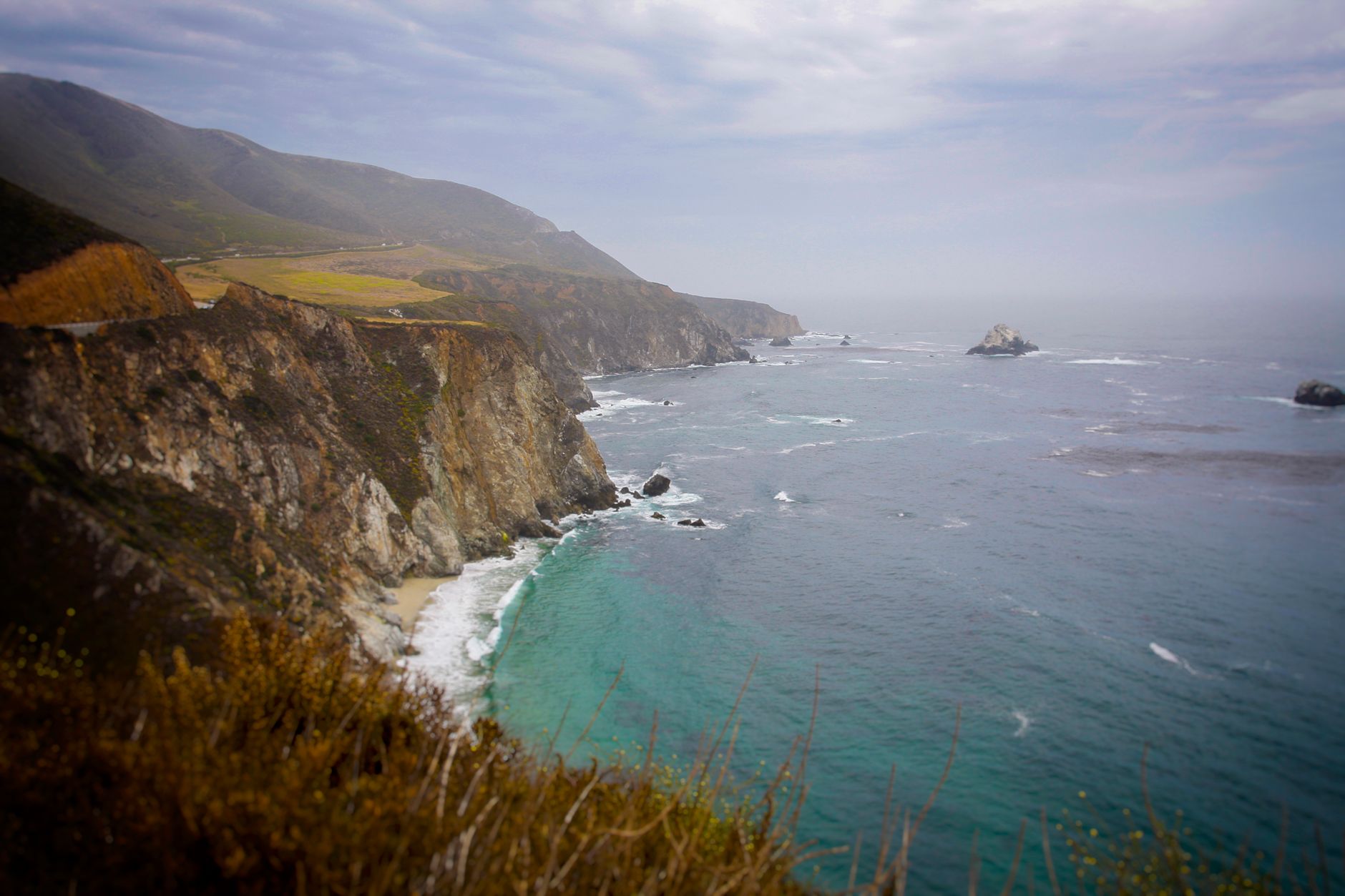 Pacific coastline with waves and dramatic cliffs